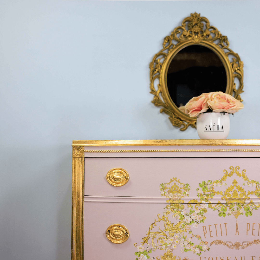 Set of drawers with trim detail and handles decorated with gold leaf