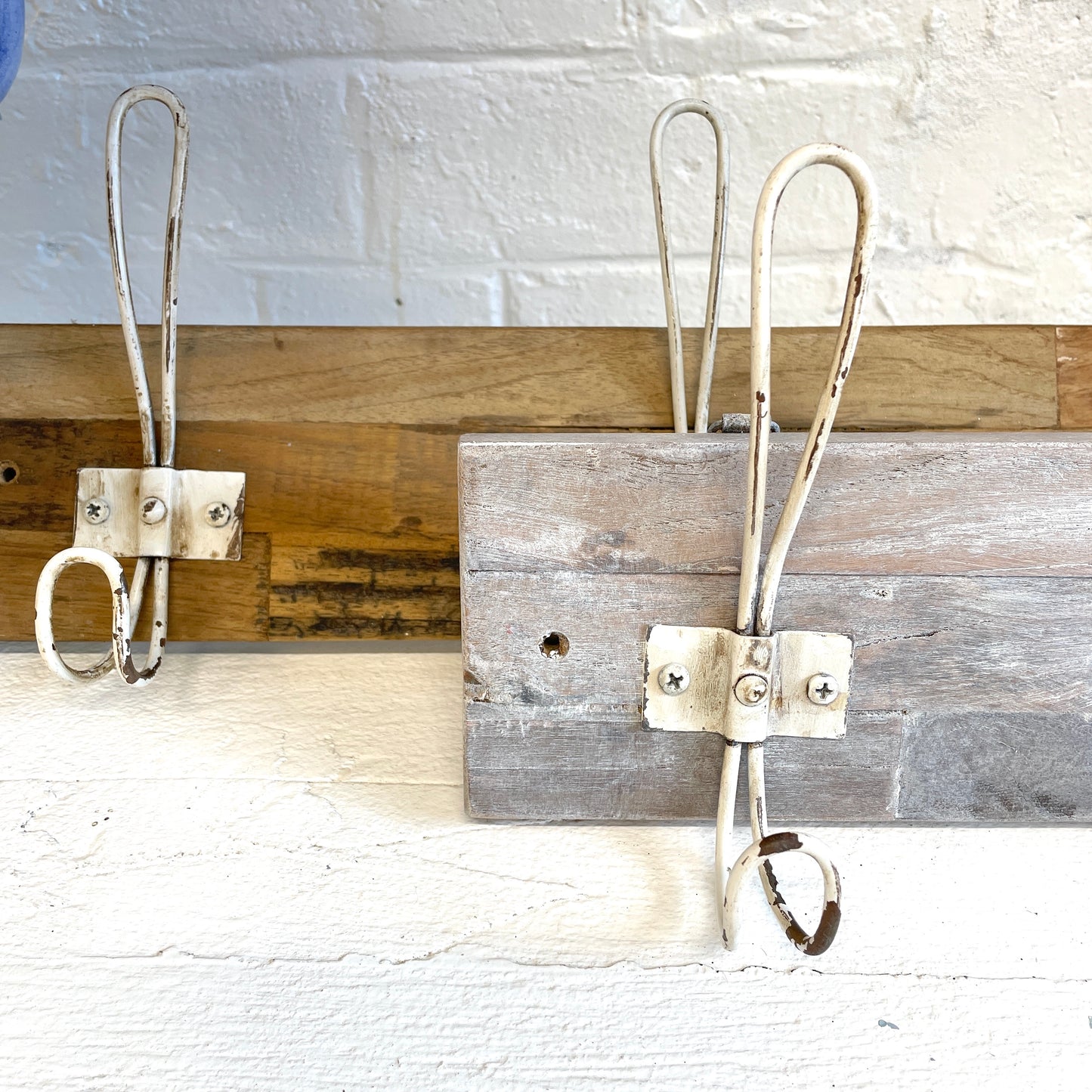 Two tmber coat racks, one with Blake & Taylor White wax applied