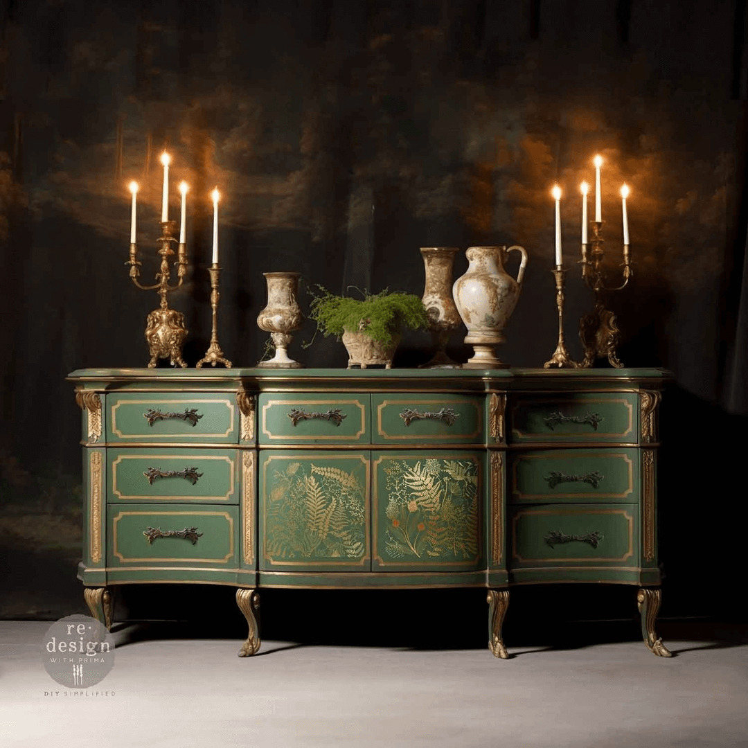 Vintage green dresser with decorative elements and candles against a dark background