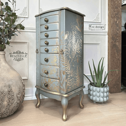Decorative jewelry cabinet with floral patterns in a room setting