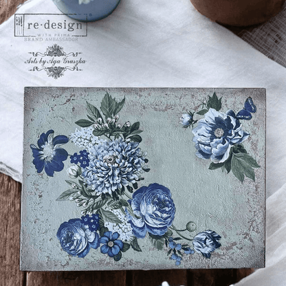 Decorative table top with blue floral design on a textured surface